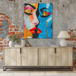 a painting of a woman's face on a brick wall