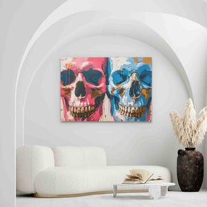 a living room with a white couch and two paintings on the wall