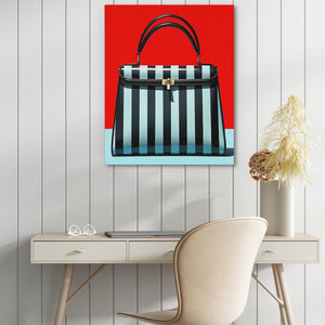 a desk with a chair and a painting on the wall