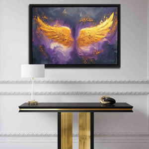 a painting on a wall above a table with a lamp
