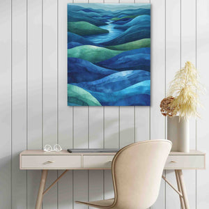 a painting on a wall above a desk