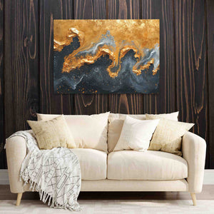 a living room with a couch and a painting on the wall