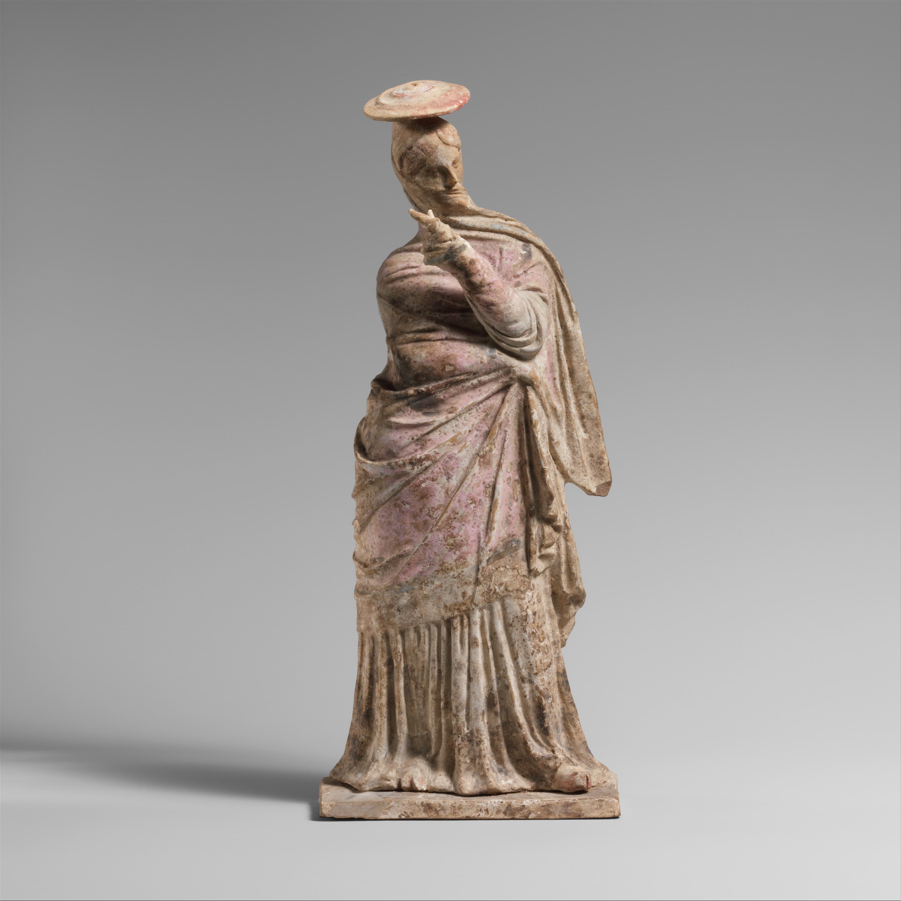 Terracotta statuette of a woman by Ancient Greek (Unknown)