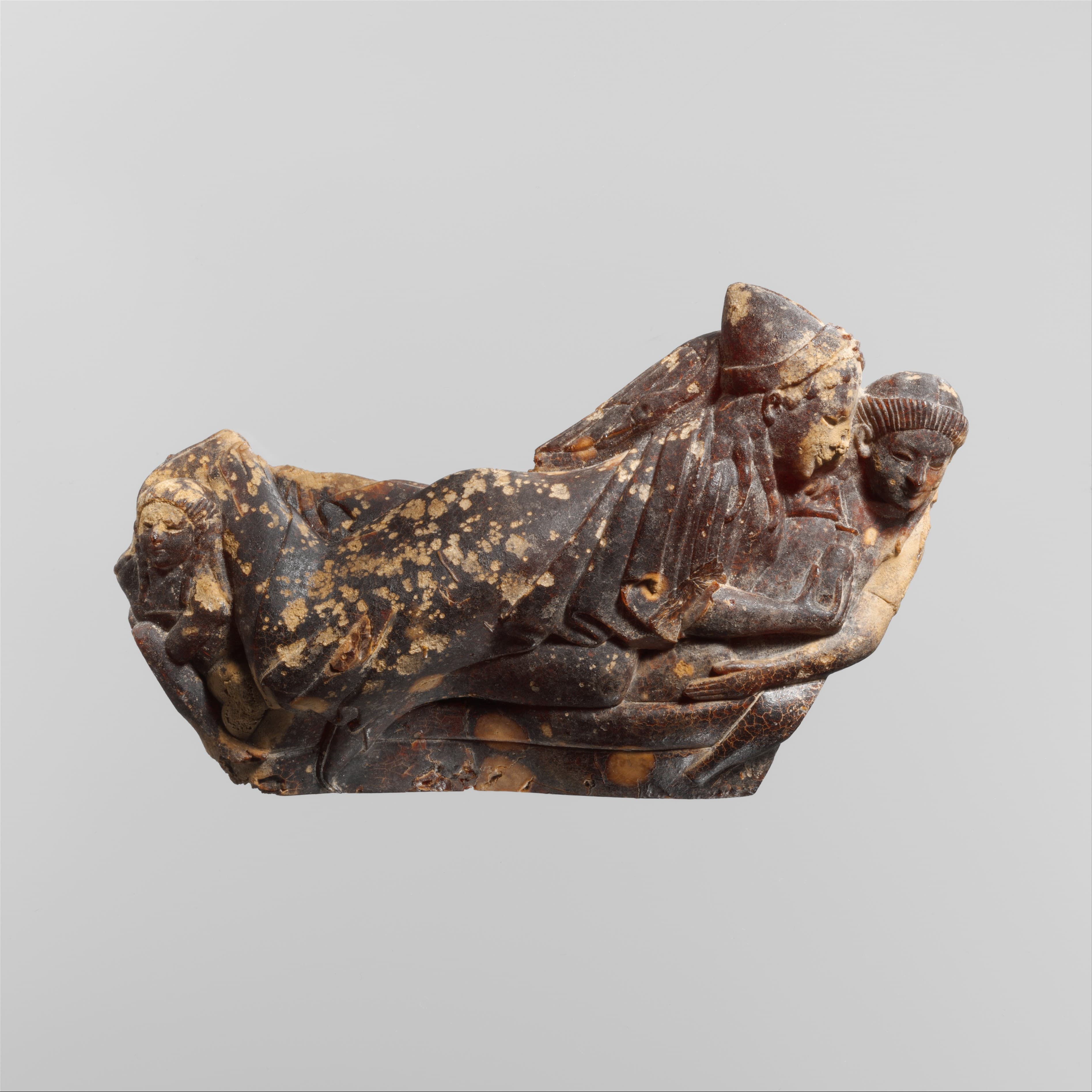 Carved amber bow of a fibula (safety pin) by Ancient Greek (Unknown)