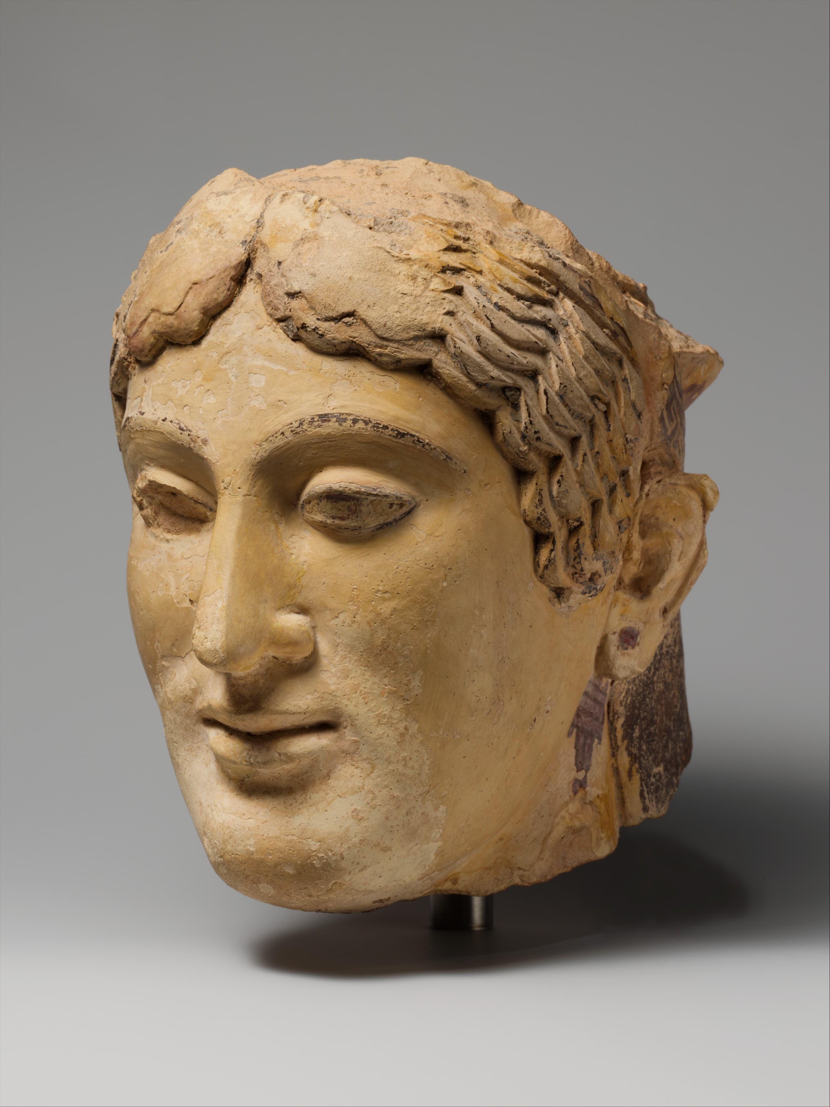 Terracotta head of a woman, probably a sphinx by Ancient Greek (Unknown)