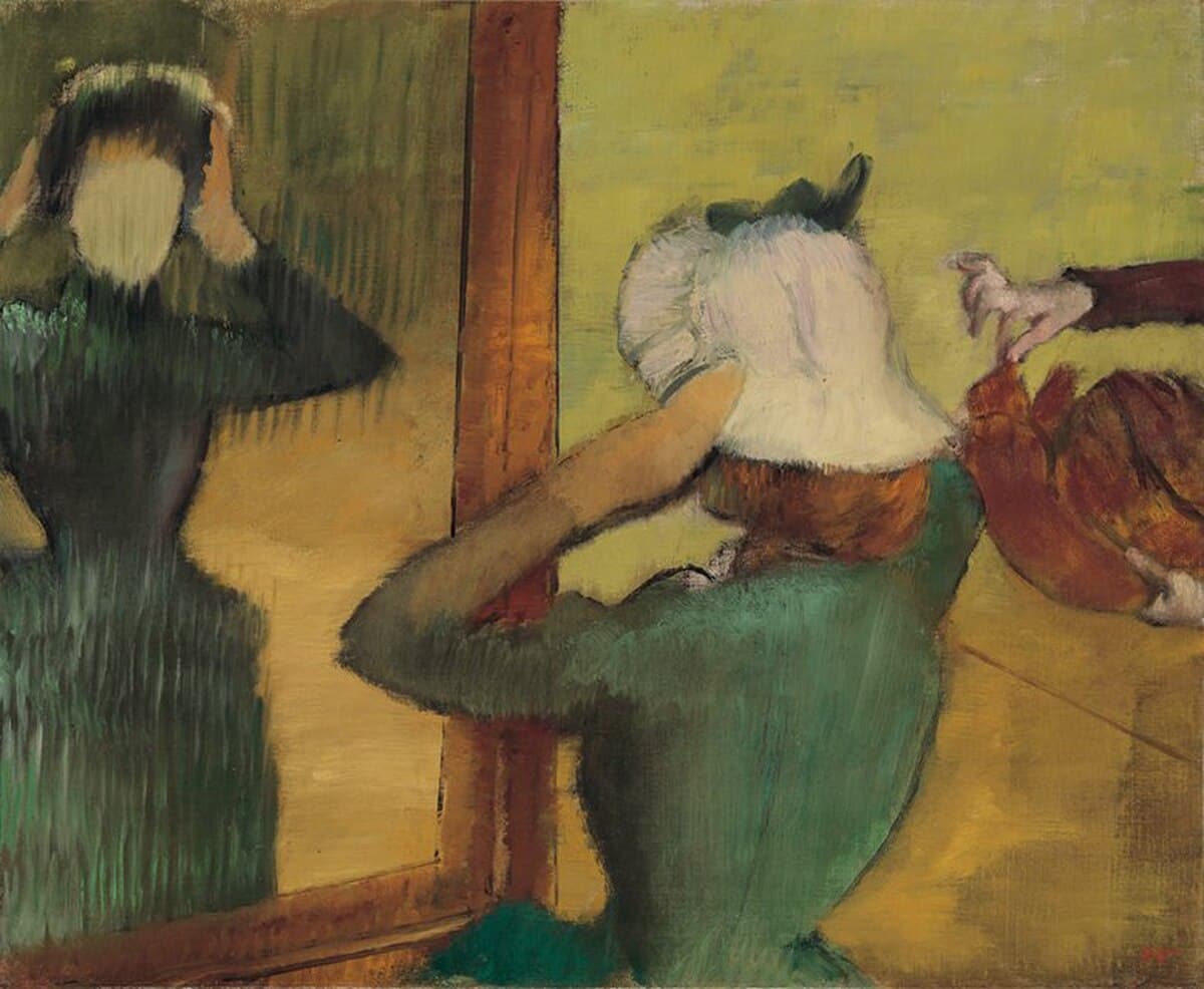 At the Milliner's by Edgar Degas