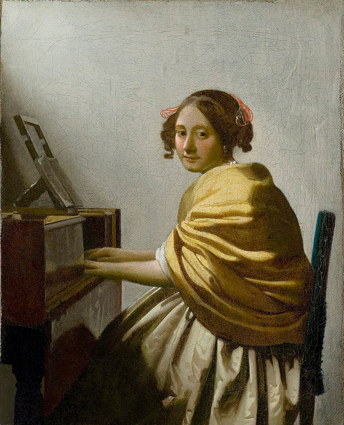 A Young Woman Seated at the Virginals by Johannes Vermeer at Leiden Collection