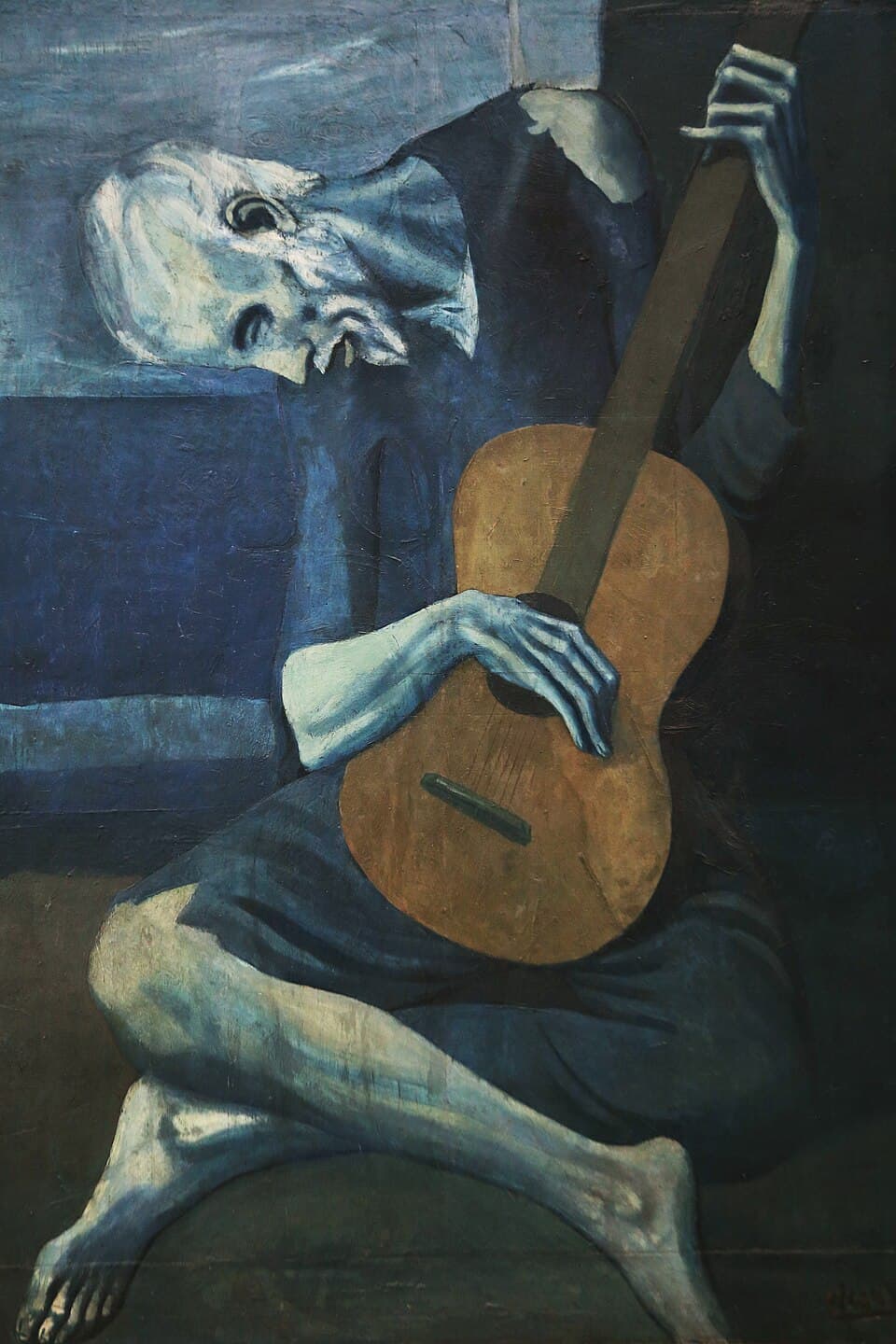 The Old Guitarist by Pablo Picasso (1903), Oil on panel at Art Institute of Chicago