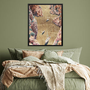 a bed with a green comforter and a painting on the wall