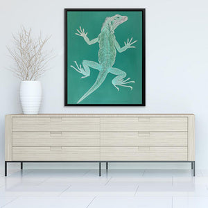 a picture of a lizard on a wall above a dresser