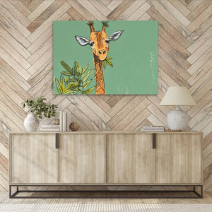 a picture of a giraffe on a wall above a sideboard