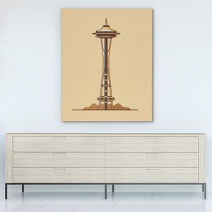 a picture of a space needle on a wall above a dresser