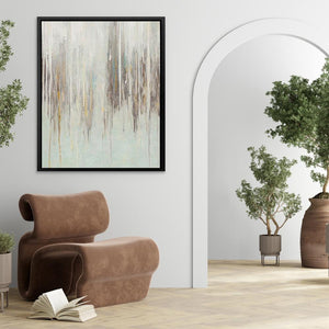 a living room with a chair and a painting on the wall