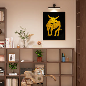 a picture of a bull on a wall above a chair