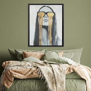 a bed with a green comforter and a painting on the wall