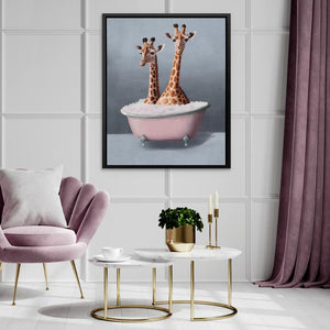 two giraffes sitting in a bathtub in a room