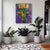 three potted plants in front of a painting on the wall