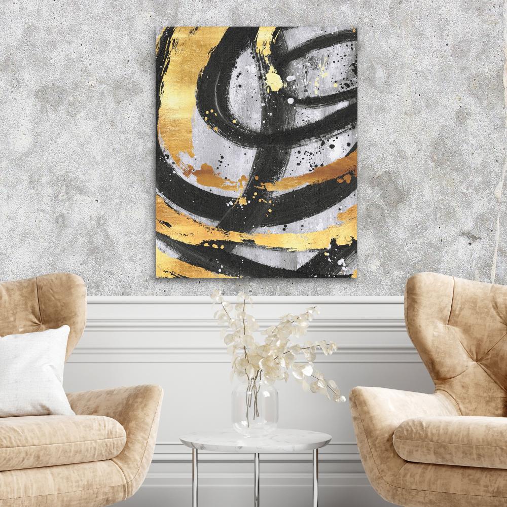 a black and gold abstract painting on a white wall