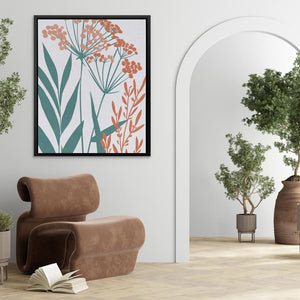 a living room with a chair, potted plant and a picture frame