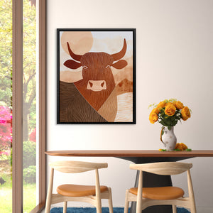 a picture of a cow on a wall above a table