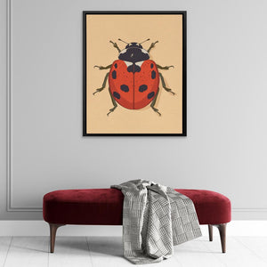 a picture of a ladybug on a wall above a bench