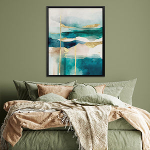 a bed with a green comforter and a painting on the wall