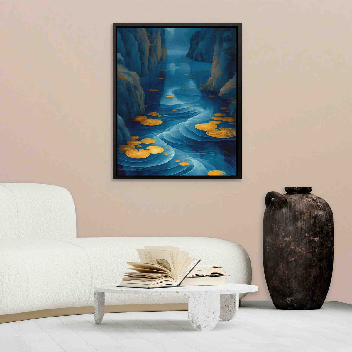 a living room with a white couch and a painting on the wall