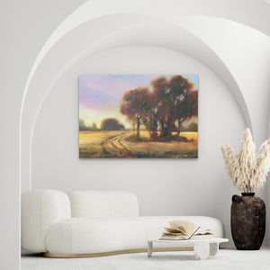 a living room with a white couch and a painting on the wall