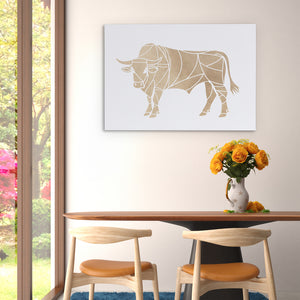 a picture of a bull on a wall above a table