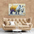 a living room with a couch and a painting of a rhino