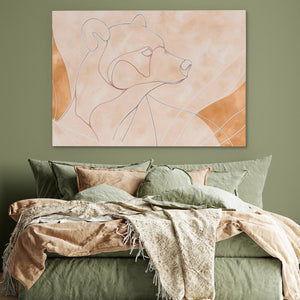 a bed with a green comforter and a painting on the wall