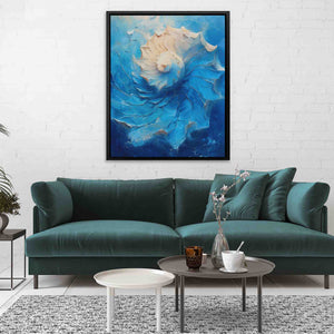 a living room with a blue couch and a painting on the wall