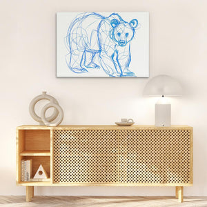 a drawing of a bear on a wall above a wooden cabinet