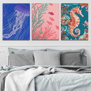 three paintings of sea animals on a wall above a bed