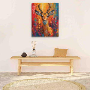 a painting of a deer on a wall above a table