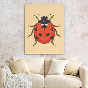 a living room with a couch and a painting of a ladybug