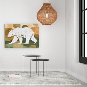 a painting of a bear on a wall next to a table