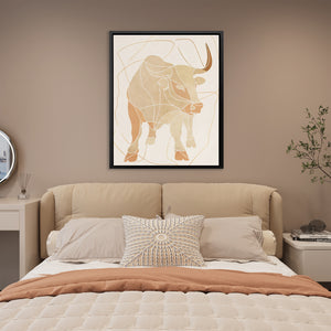 a picture of a bull on a wall above a bed