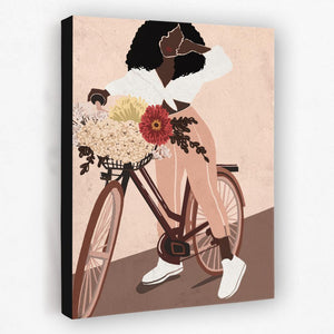 a woman riding a bike with flowers in the basket