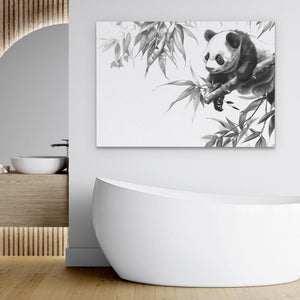 a panda bear sitting on top of a bamboo tree