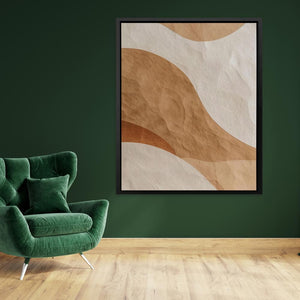 a living room with a green chair and a painting on the wall