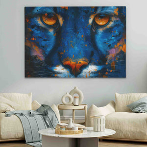 a painting of a blue tiger's face on a wall