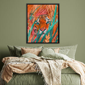 a picture of a tiger in the grass on a wall above a bed