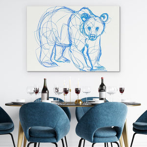 a drawing of a bear on a wall above a table