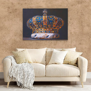 a painting of a crown on a wall above a couch