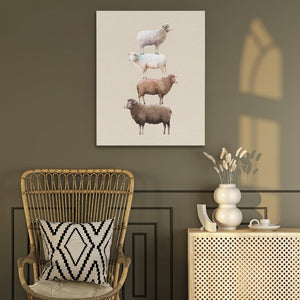 three sheep standing on top of each other on a wall