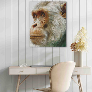 a painting of a monkey on a wall next to a desk