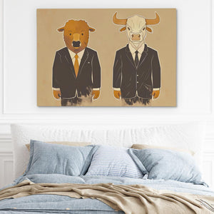 a bed with a blue comforter and a painting of a bull and a bear