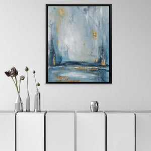 a painting hanging on a wall above a white cabinet