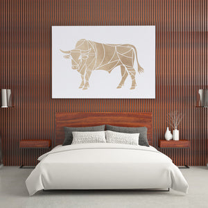 a picture of a bull on a wall above a bed